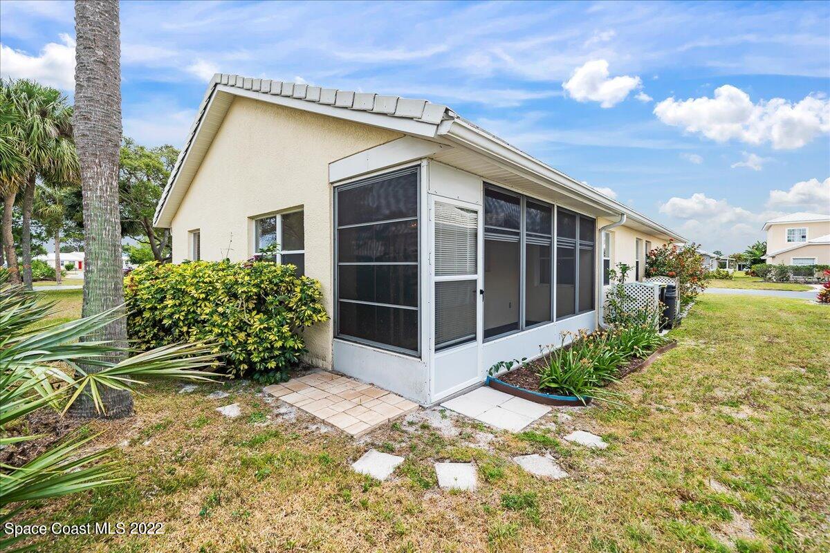 1965 Sundew Court Northeast Palm Bay, FL 32905 - Photo 27 of 29 a view of a house with backyard and garden