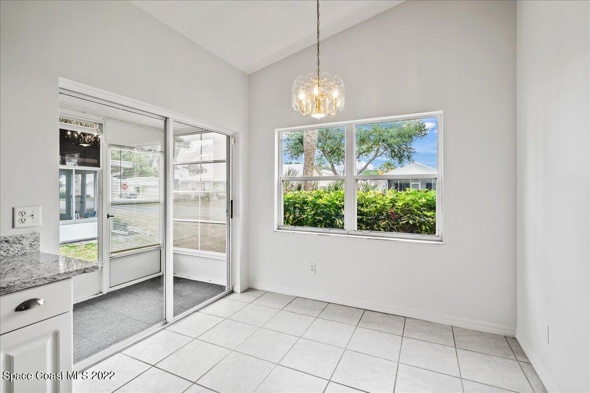 1965 Sundew Court Northeast Palm Bay, FL 32905 - Photo 10 of 29 a view of a livingroom with furniture wooden floor and window