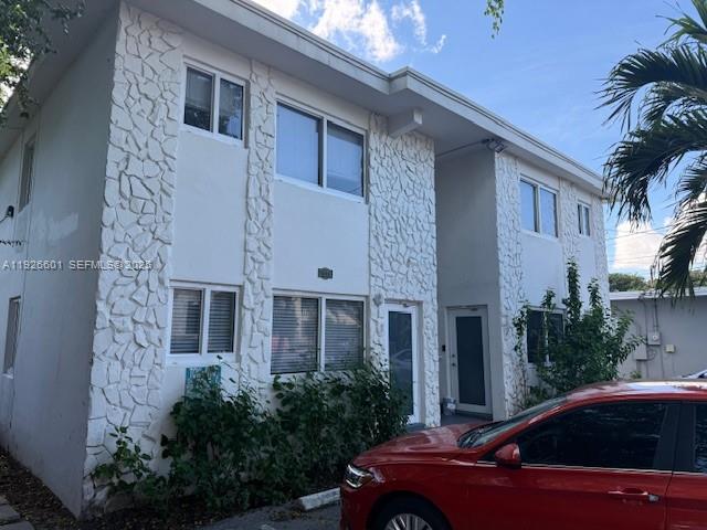 2006 Calais Drive, Unit 1 Miami Beach, FL 33141 - Photo 2 of 12 a front view of a house with parking space