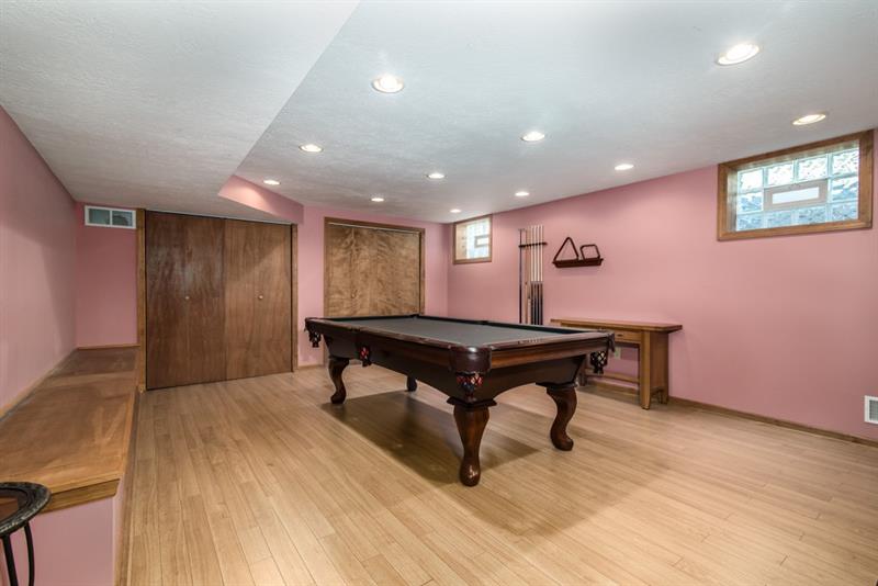 13 Rolling Road Cranberry Township, PA 16066 - Photo 20 of 24 Large Game Room with hinged bench seating and vented glass block windows. Pool table and accessories are included in sale.