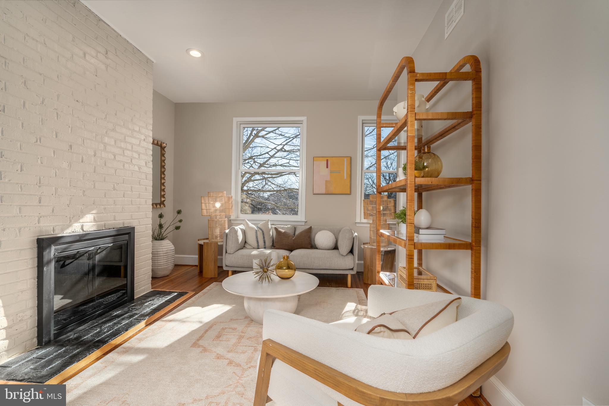 1218 D Street Southeast, Unit 4 Washington, DC 20003 - Photo 1 of 30 a living room with furniture a fireplace and a flat screen tv