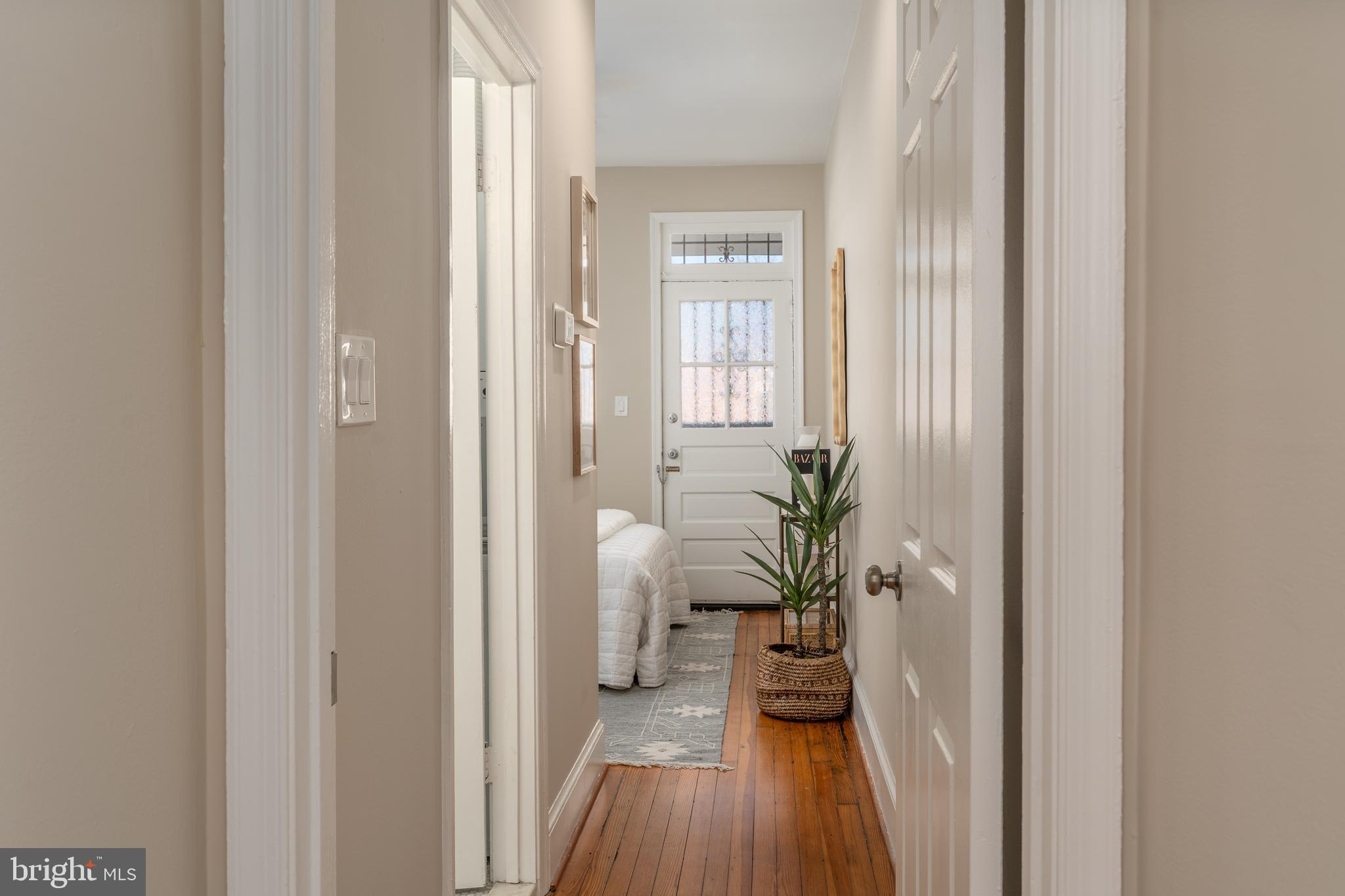 1218 D Street Southeast, Unit 4 Washington, DC 20003 - Photo 17 of 30 a view of a hallway with wooden floor and a livingroom