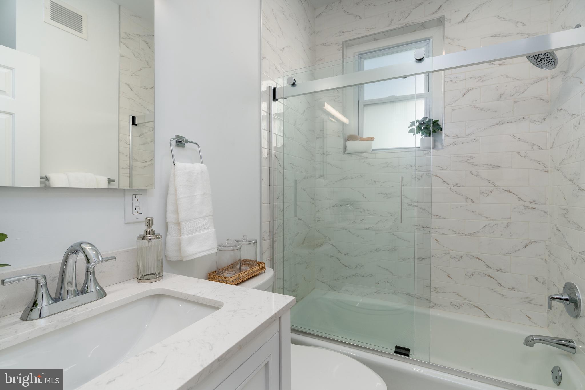 1218 D Street Southeast, Unit 4 Washington, DC 20003 - Photo 18 of 30 a bathroom with a sink and a shower
