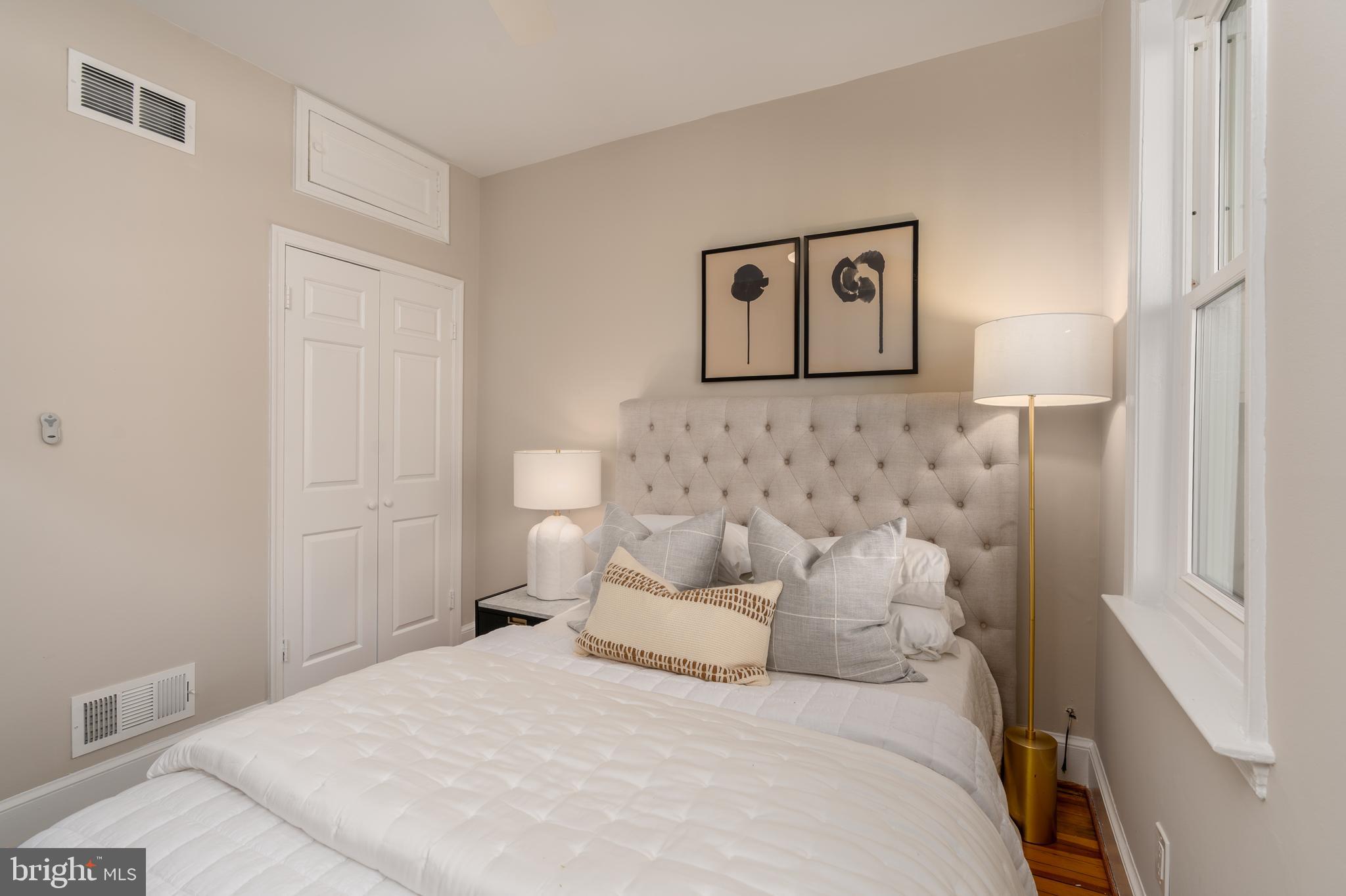 1218 D Street Southeast, Unit 4 Washington, DC 20003 - Photo 21 of 30 a bedroom with a bed and a window