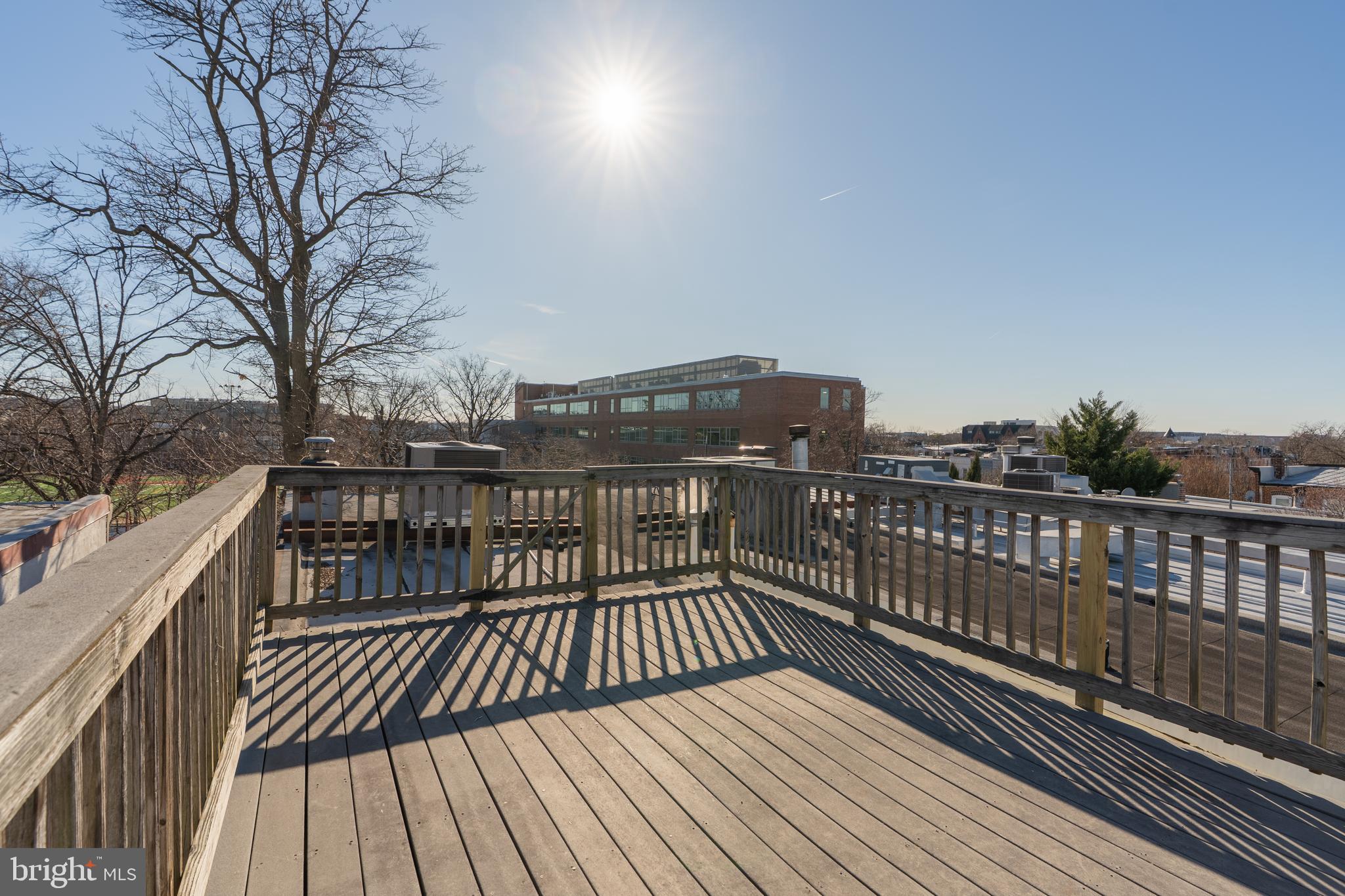1218 D Street Southeast, Unit 4 Washington, DC 20003 - Photo 27 of 30 a view of balcony with wooden floor and fence