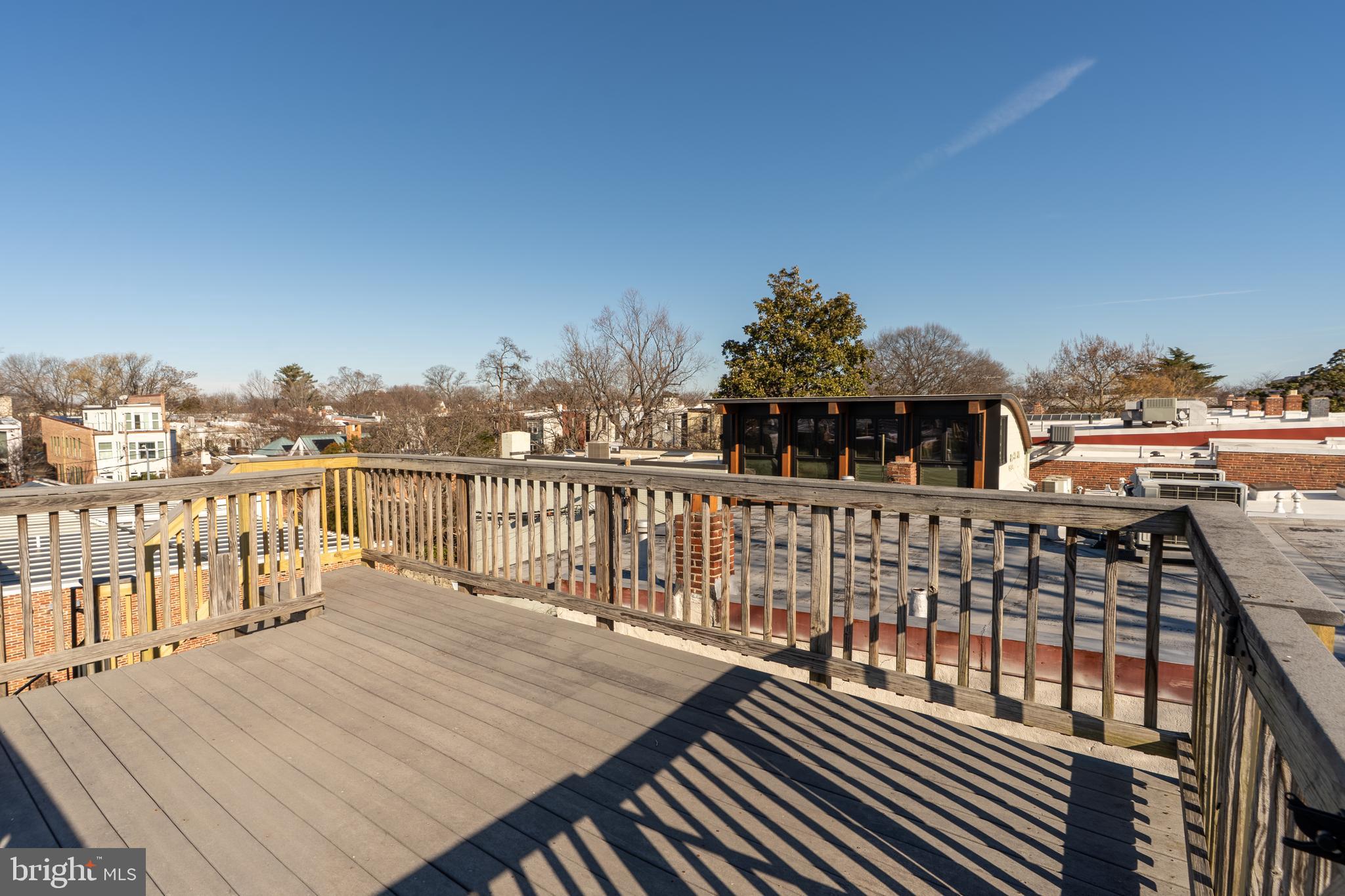 1218 D Street Southeast, Unit 4 Washington, DC 20003 - Photo 29 of 30 a view of a balcony with wooden floor