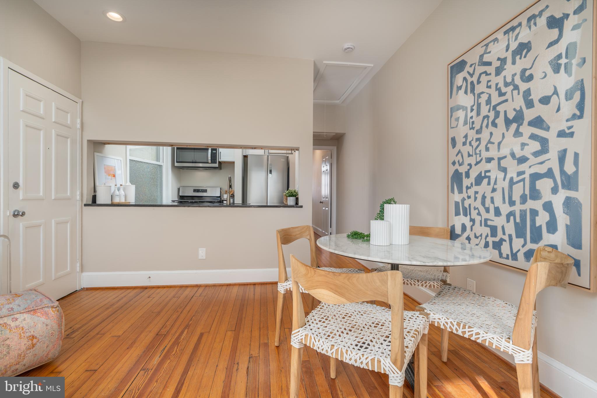 1218 D Street Southeast, Unit 4 Washington, DC 20003 - Photo 7 of 30 a view of a dining room with furniture and wooden floor