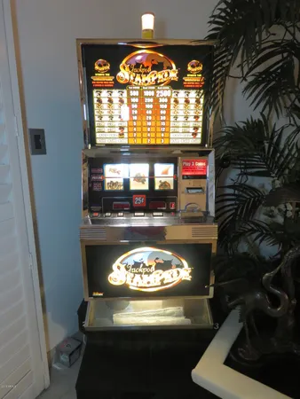 a view of a livingroom with a fireplace a rug and a window