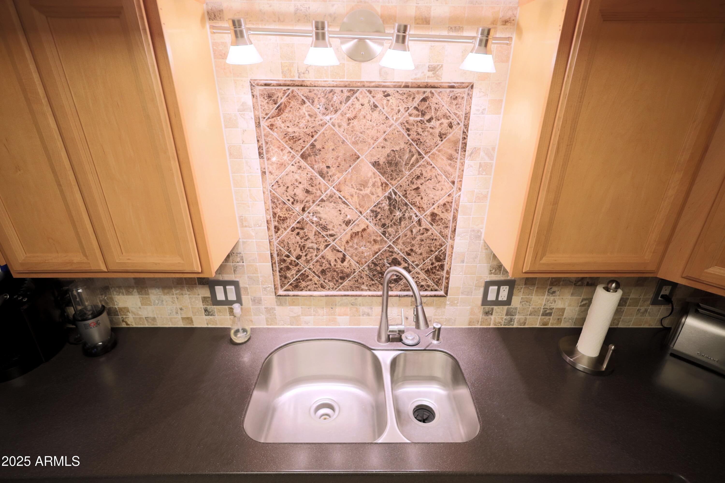 7820 East Camelback Road, Unit 309 Scottsdale, AZ 85251 - Photo 14 of 55 a bathroom with a sink and a mirror