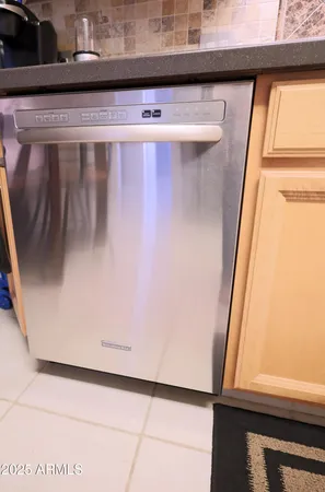 a view of water heater room with wooden floor