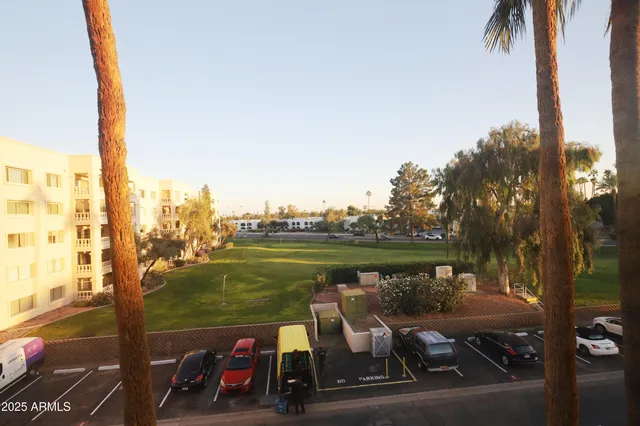 a bedroom with bed and wooden floor