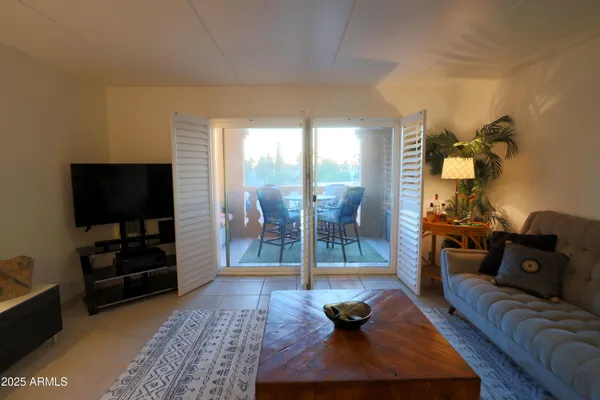 a view of a chairs and table in patio