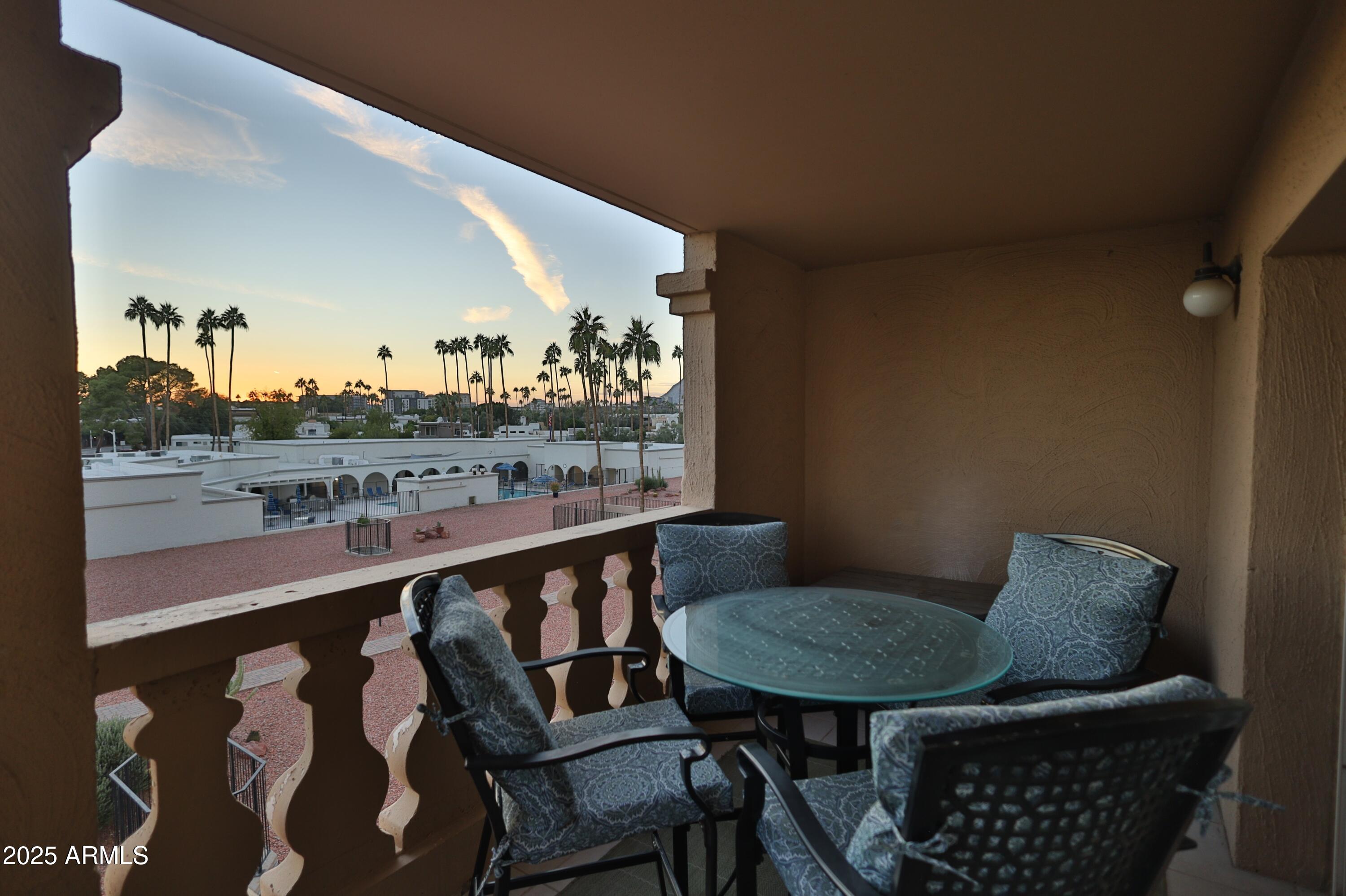 7820 East Camelback Road, Unit 309 Scottsdale, AZ 85251 - Photo 36 of 55 a view of a chairs and table in patio