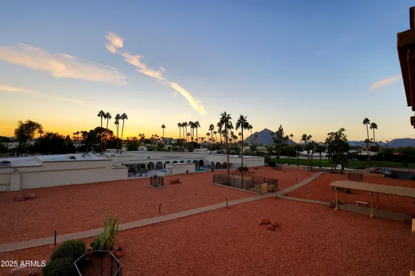 a view of parking garage with cars