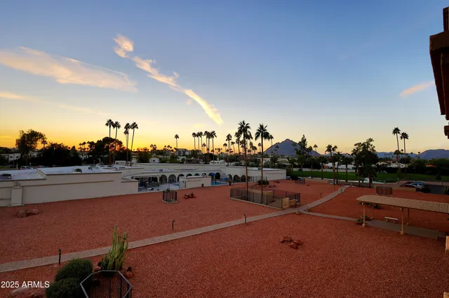 a view of parking garage with cars