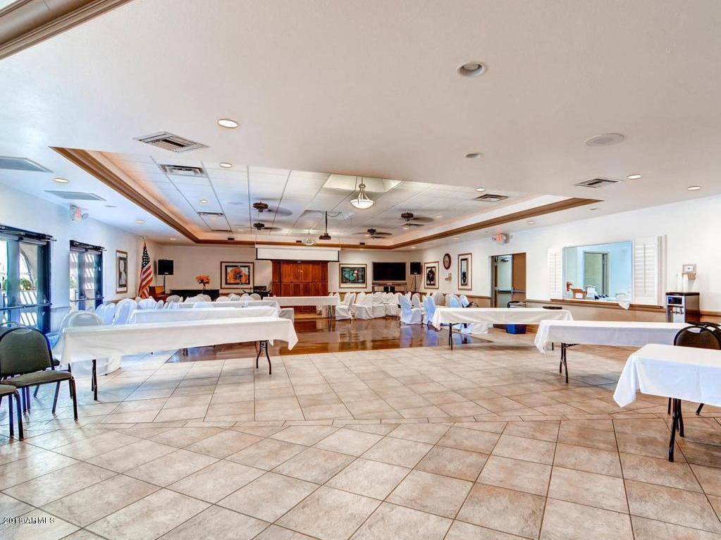 7820 East Camelback Road, Unit 309 Scottsdale, AZ 85251 - Photo 43 of 55 a living room with furniture and a large window