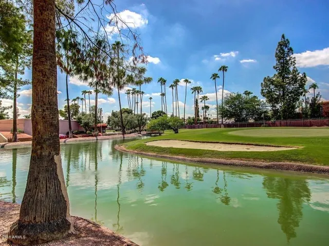a room with furniture and pool table