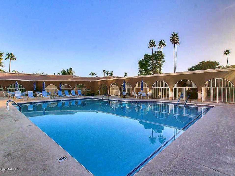 7820 East Camelback Road, Unit 309 Scottsdale, AZ 85251 - Photo 50 of 55 a view of a swimming pool with an outdoor seating