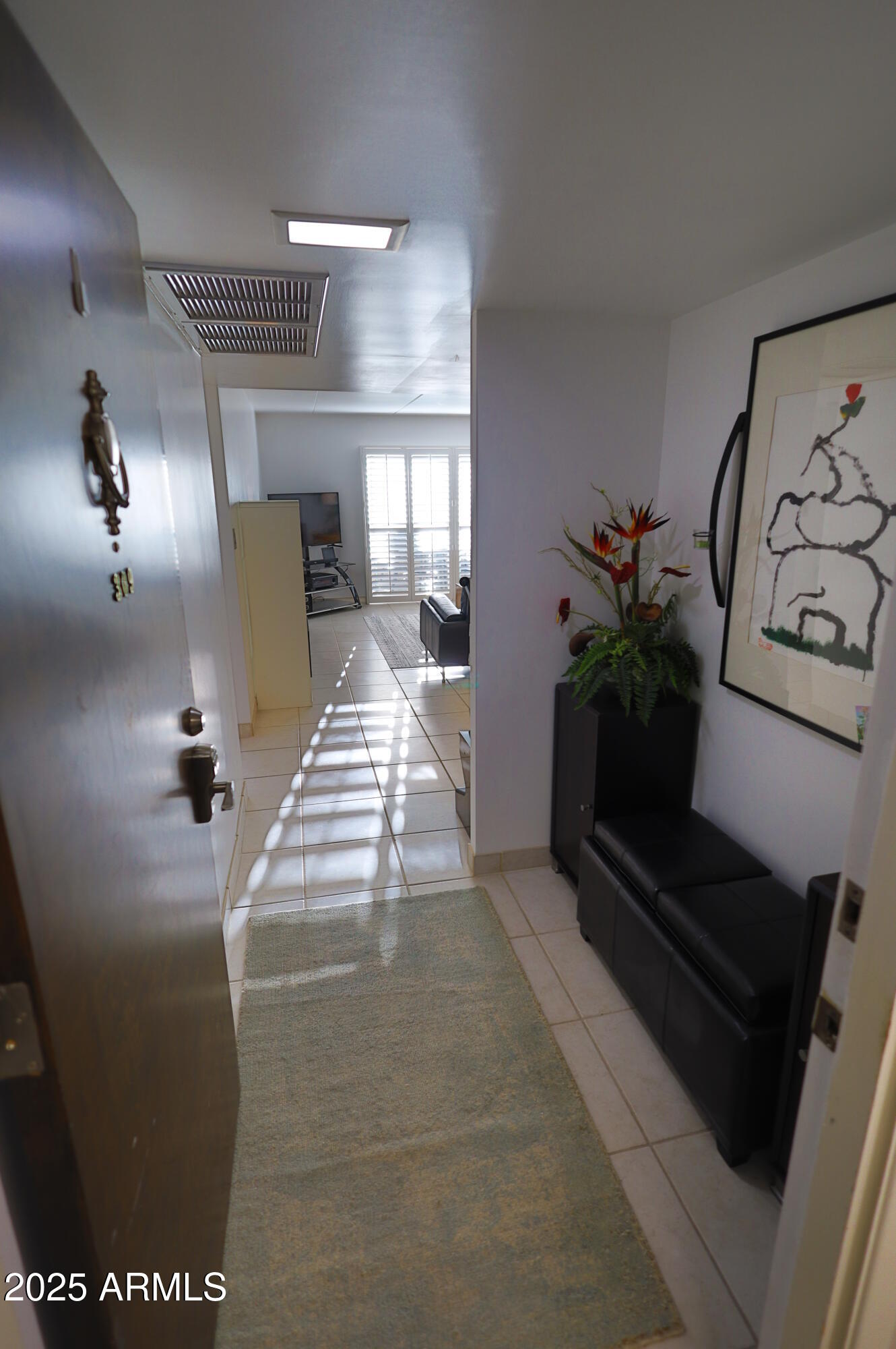7820 East Camelback Road, Unit 309 Scottsdale, AZ 85251 - Photo 7 of 55 a lobby with furniture and potted plants
