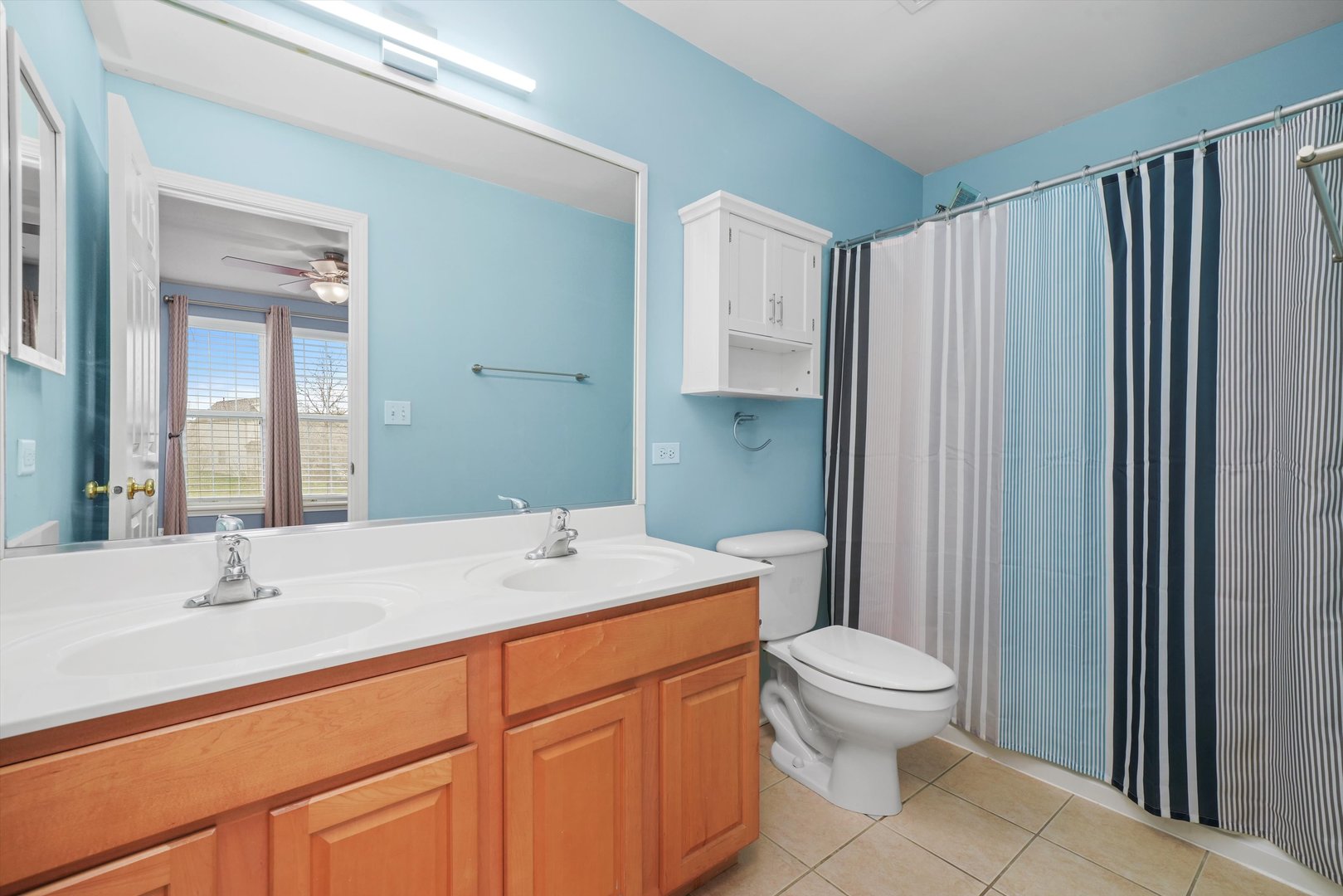 790 Montclair Drive Round Lake, IL 60073 - Photo 16 of 21 a bathroom with a sink a toilet and shower