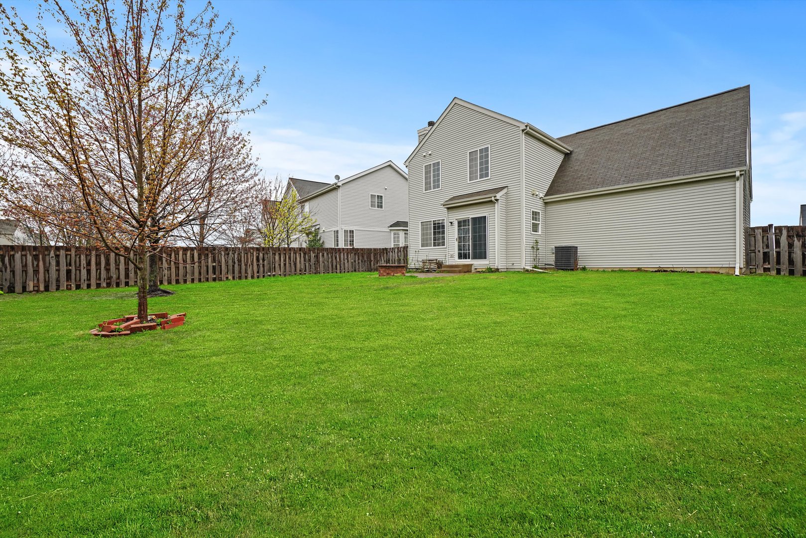 790 Montclair Drive Round Lake, IL 60073 - Photo 19 of 21 a front view of a house with a yard