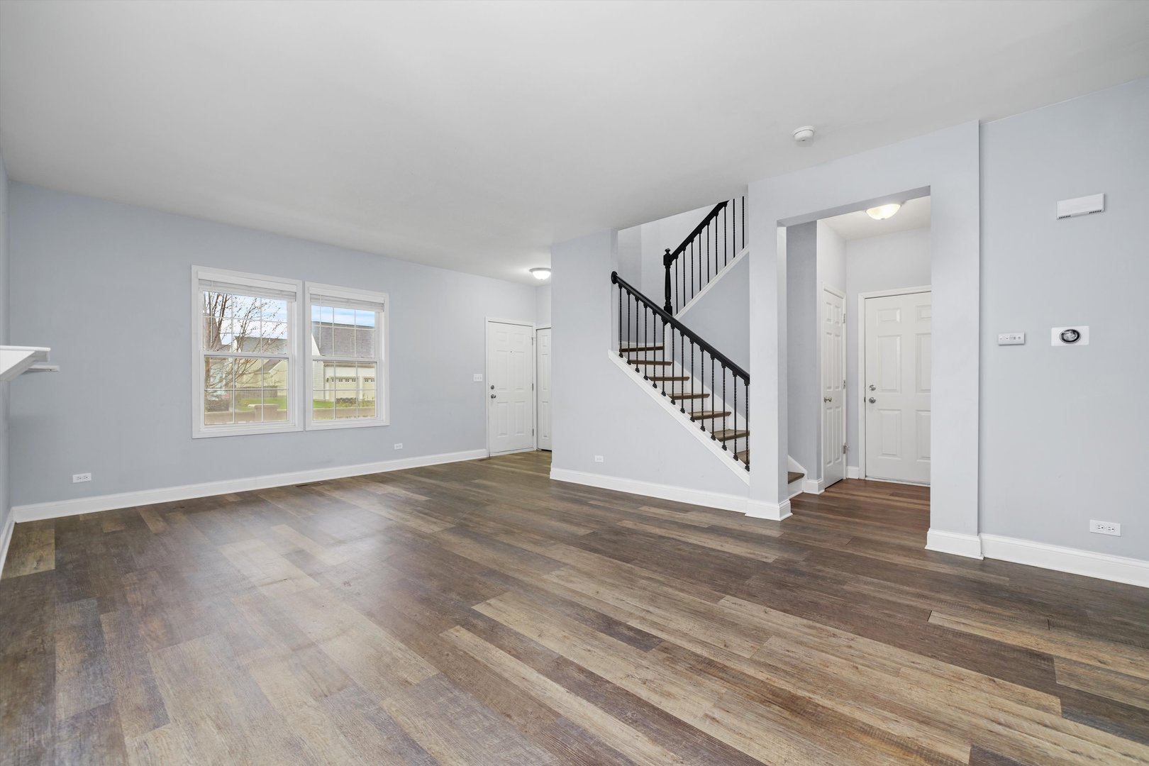 790 Montclair Drive Round Lake, IL 60073 - Photo 3 of 21 a view of an entryway with wooden floor and staircase