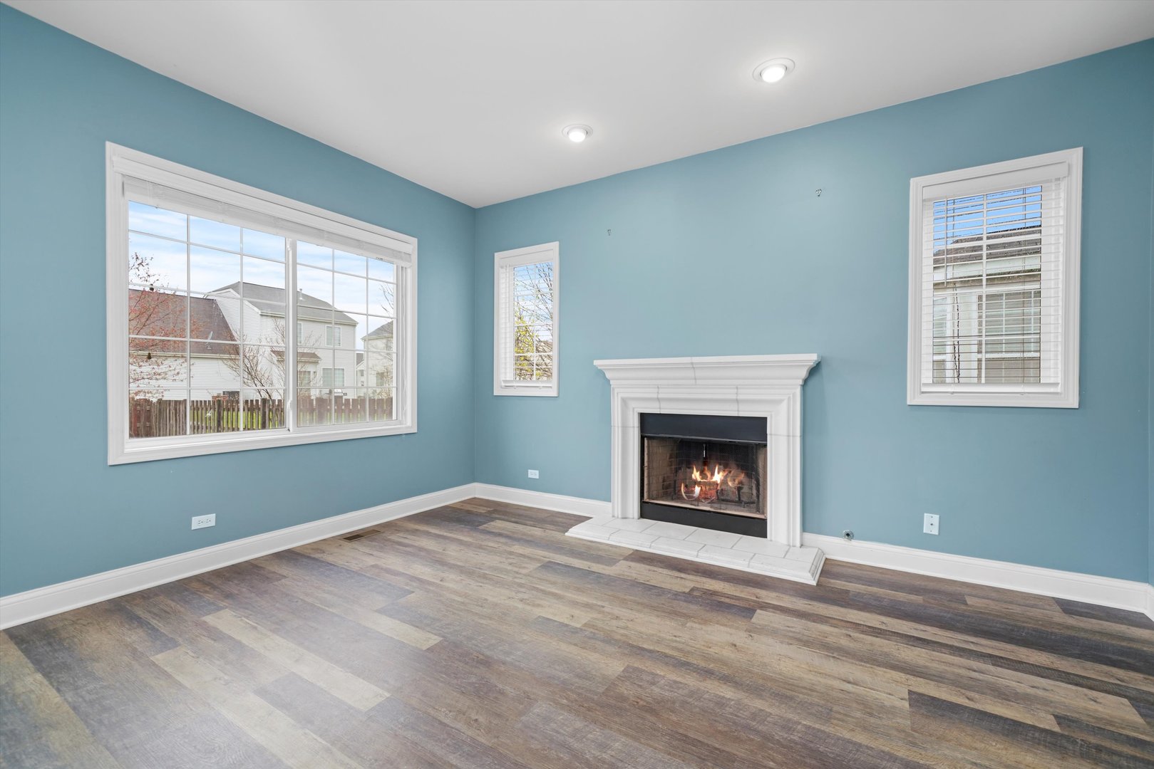 790 Montclair Drive Round Lake, IL 60073 - Photo 5 of 21 a view of an empty room with window and fire place