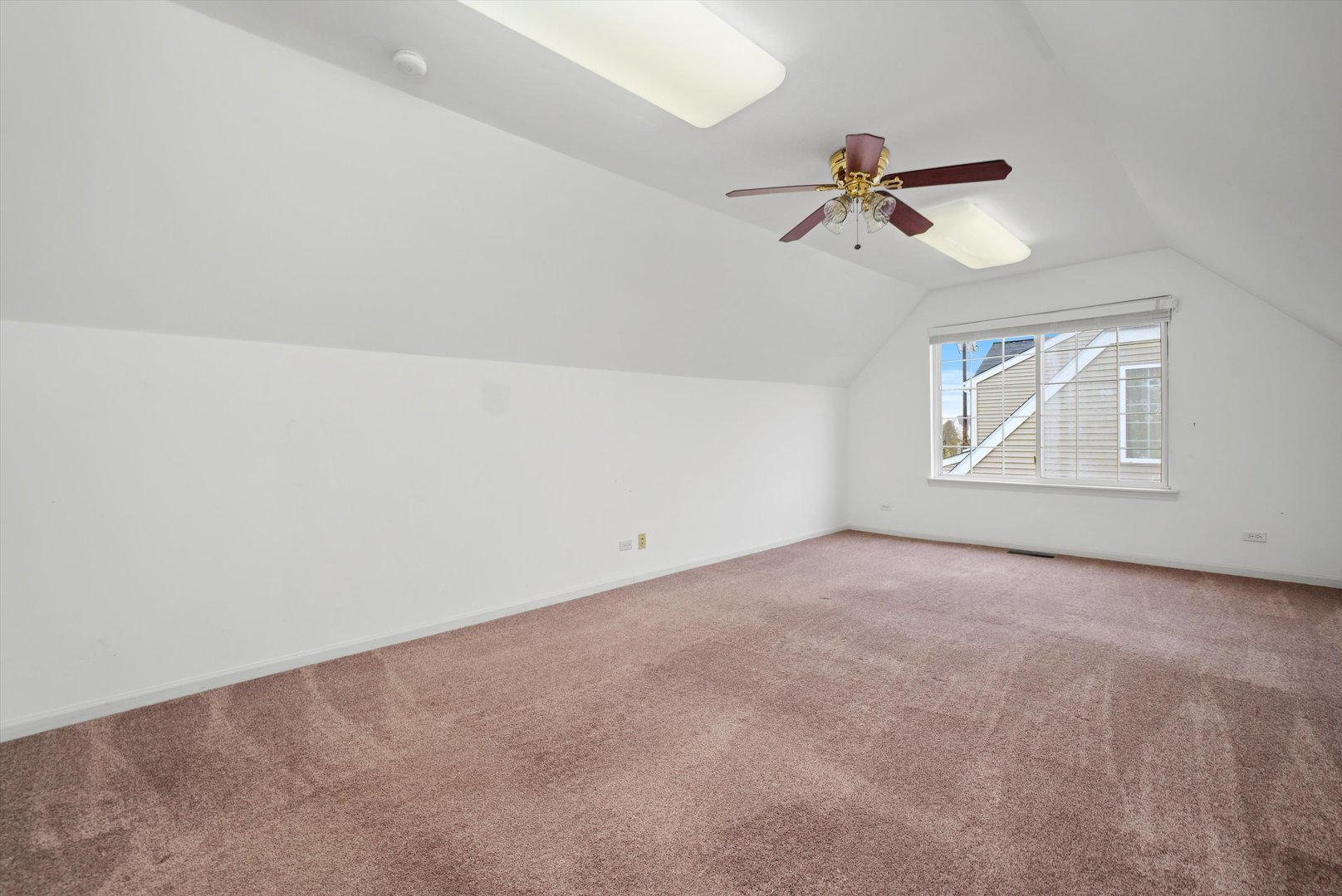 790 Montclair Drive Round Lake, IL 60073 - Photo 9 of 21 an empty room with windows and fan