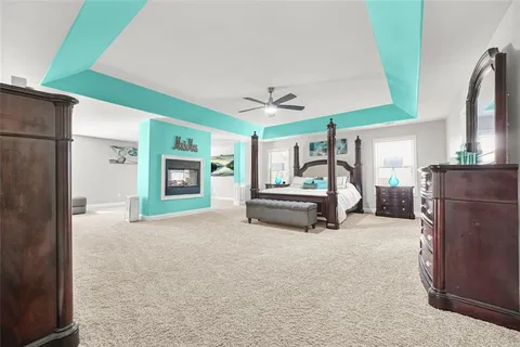 a bedroom with a bed and a fireplace