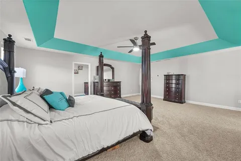 a bathroom with a bathtub sink and mirror