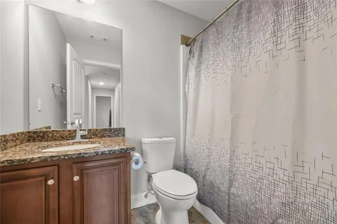 a living room with a couch and a chandelier
