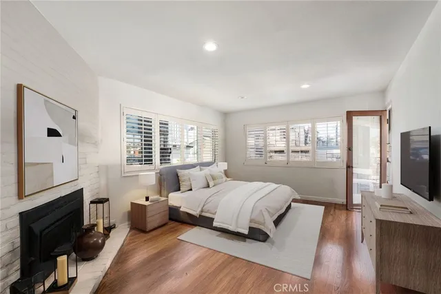 a bedroom with a bed and a flat tv screen