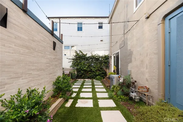 a view of a backyard with potted plants