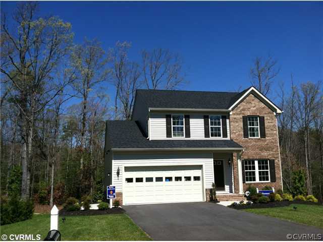 1903 River Ridge Place Hopewell, VA 23860 - Photo 1 of 1 a view of a house with a yard and garage