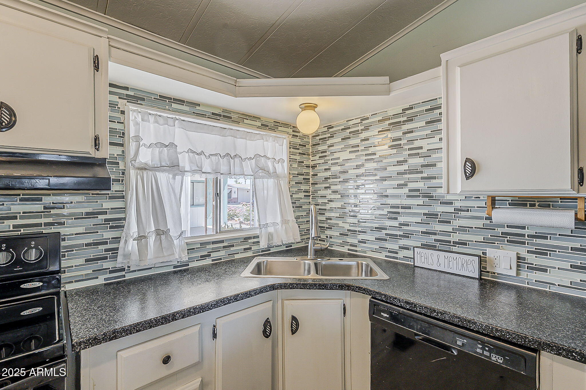834 South Meridian Road, Unit 118 Apache Junction, AZ 85120 - Photo 15 of 43 a kitchen with stainless steel appliances a sink and cabinets
