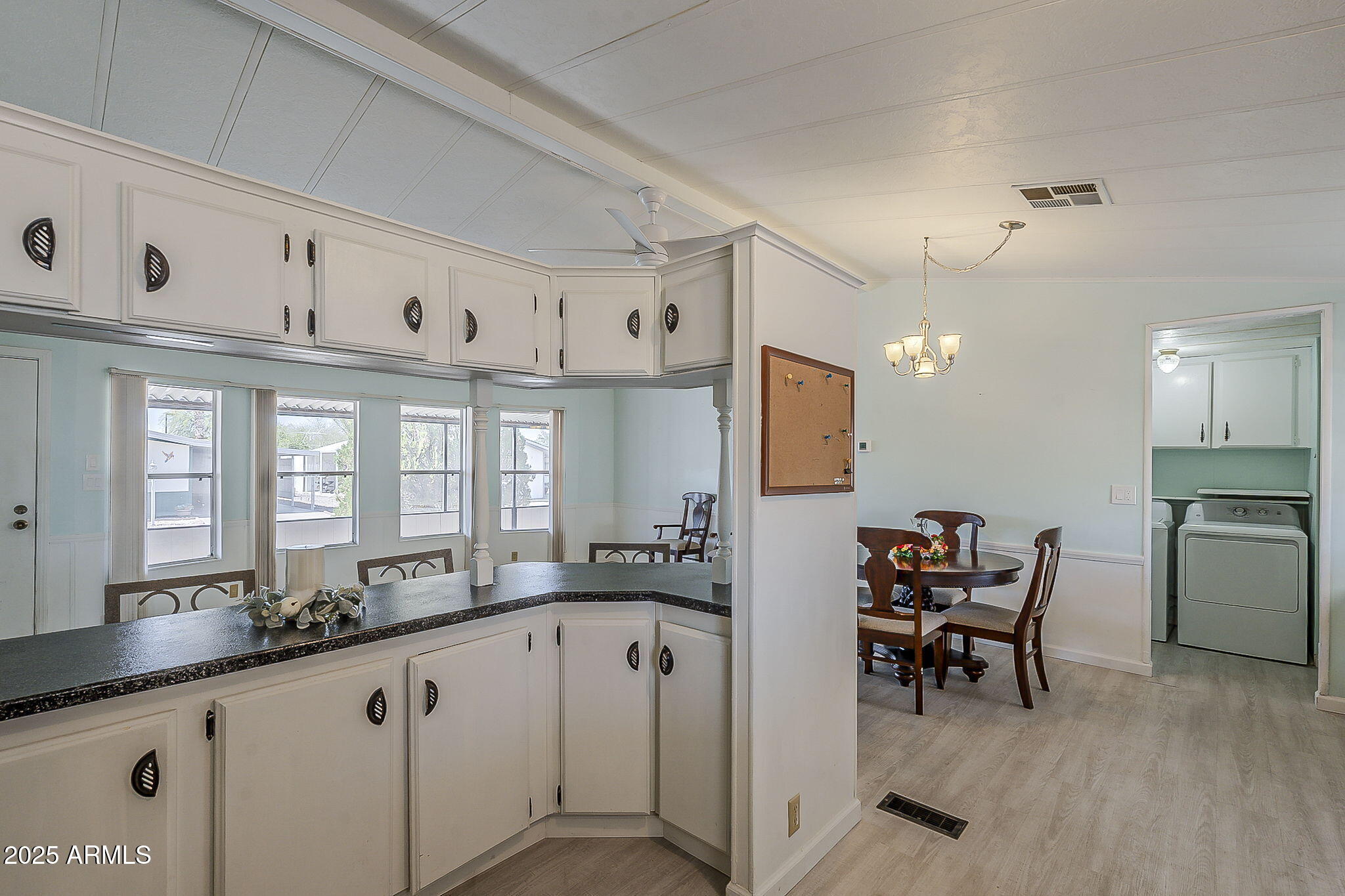 834 South Meridian Road, Unit 118 Apache Junction, AZ 85120 - Photo 16 of 43 a large white kitchen with a large window