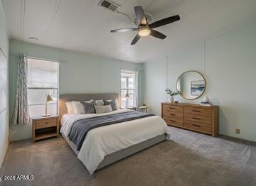 834 South Meridian Road, Unit 118 Apache Junction, AZ 85120 - Photo 26 of 45 a bed room with a bed and a chandelier