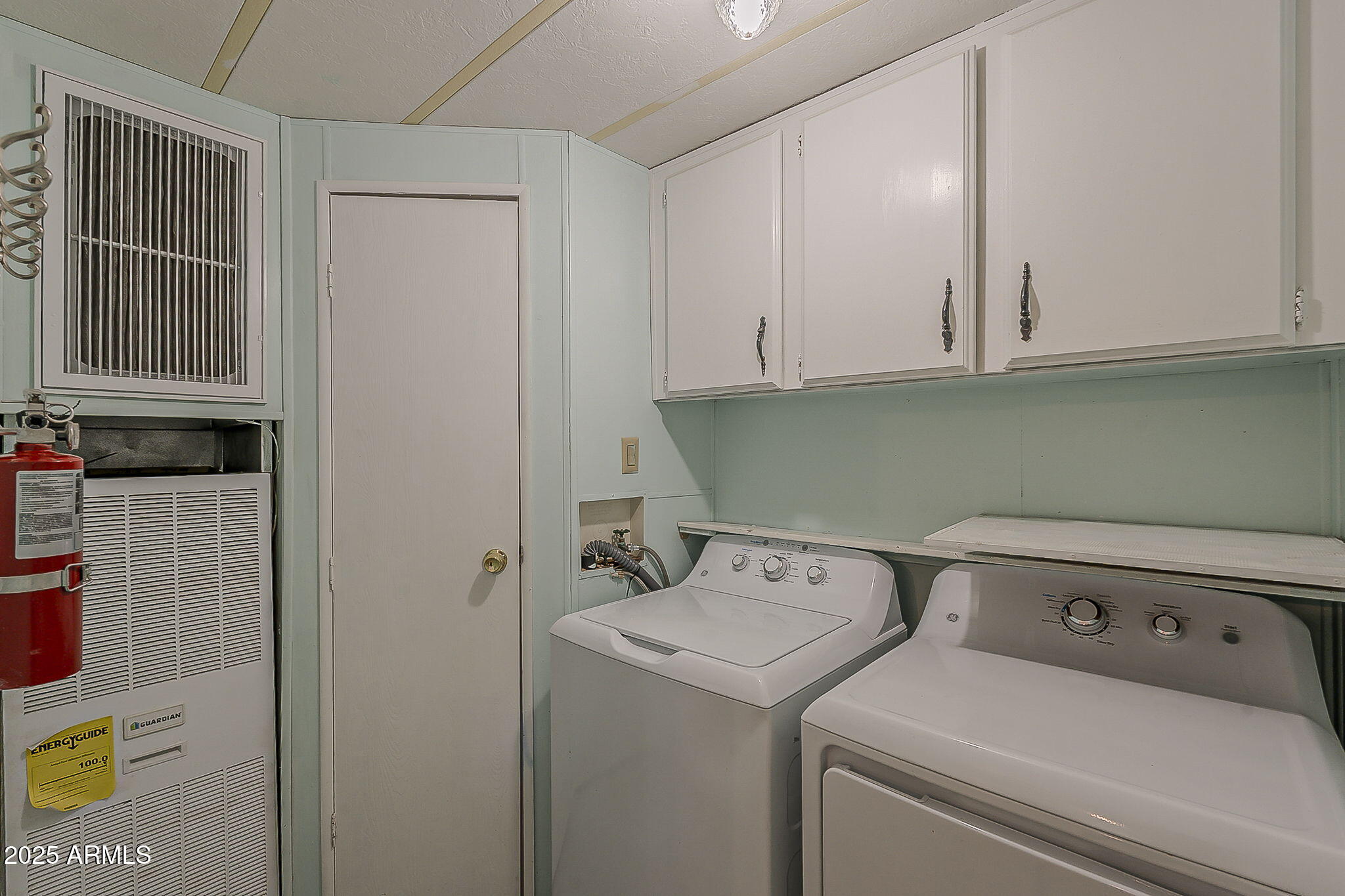834 South Meridian Road, Unit 118 Apache Junction, AZ 85120 - Photo 37 of 45 a view of storage and utility room with washer and dryer