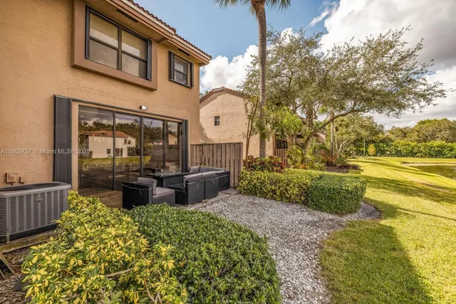 a garden view with a seating space