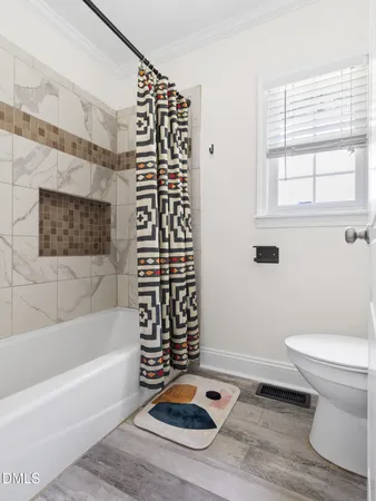 a bathroom with a toilet a sink and a bathtub
