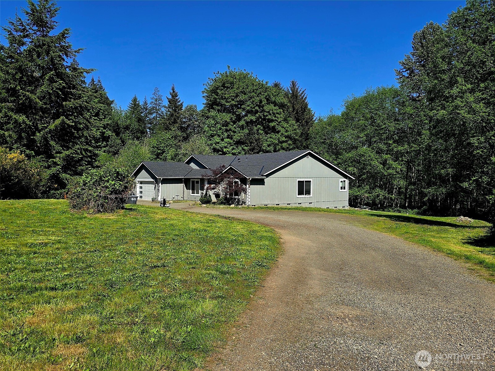 6611 Crescent Beach Road Northwest Vaughn, WA 98394 - Photo 16 of 17 a front view of a house with garden