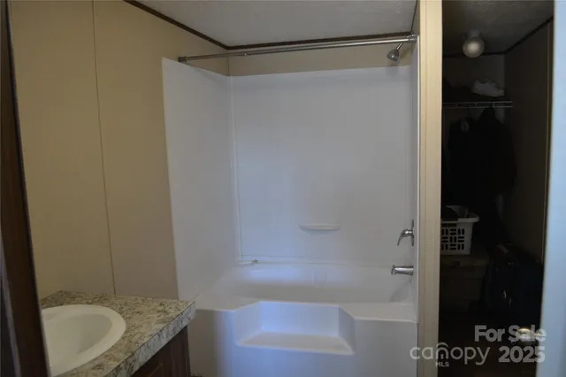 a bathroom with a sink and a shower