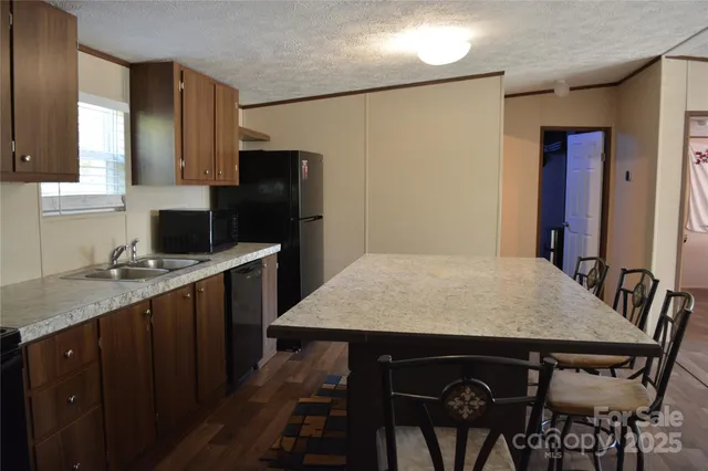 a kitchen with a table and chairs