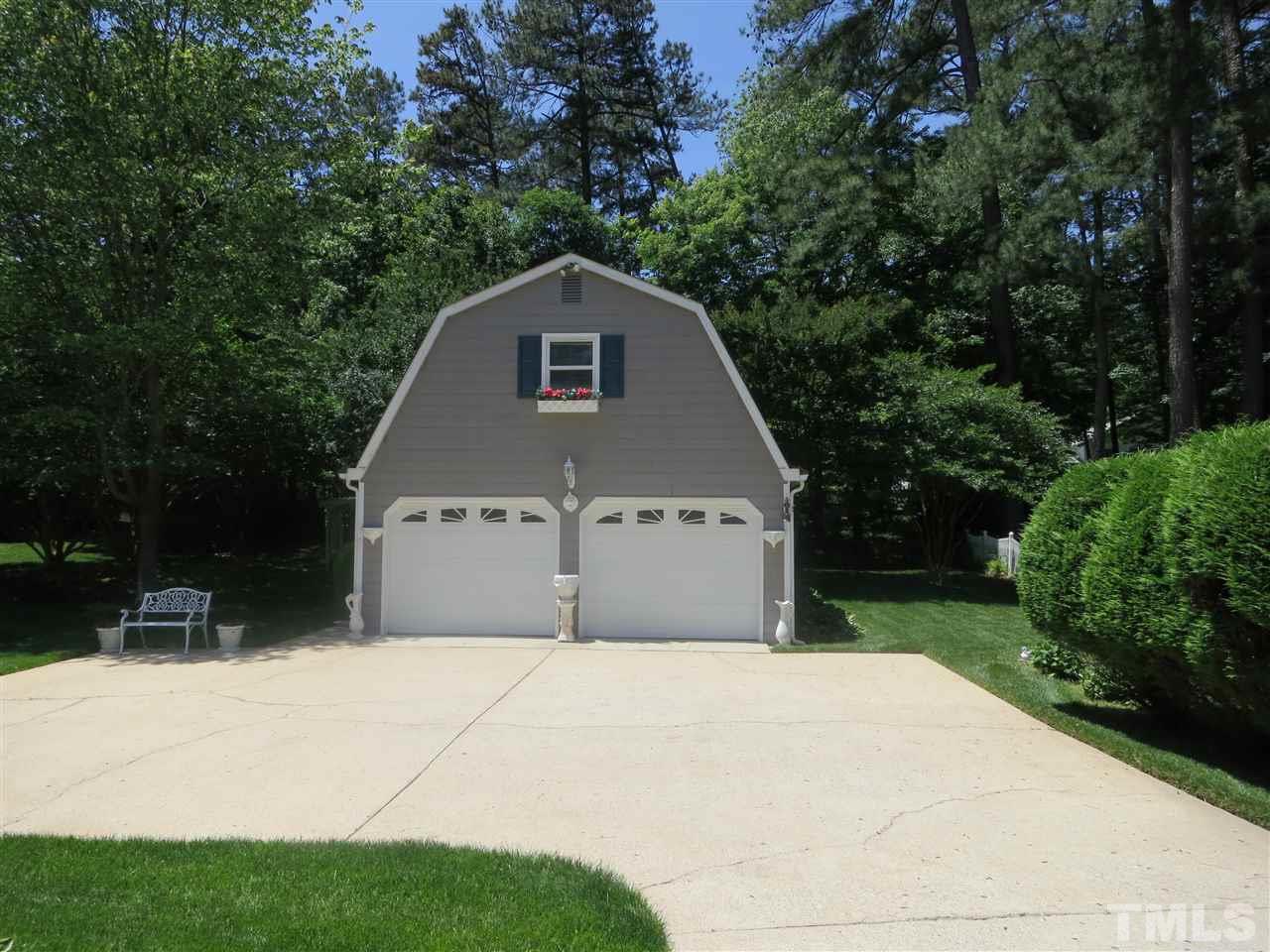 6701 Valley Drive Raleigh, NC 27612 - Photo 2 of 4 a front view of a house with a yard