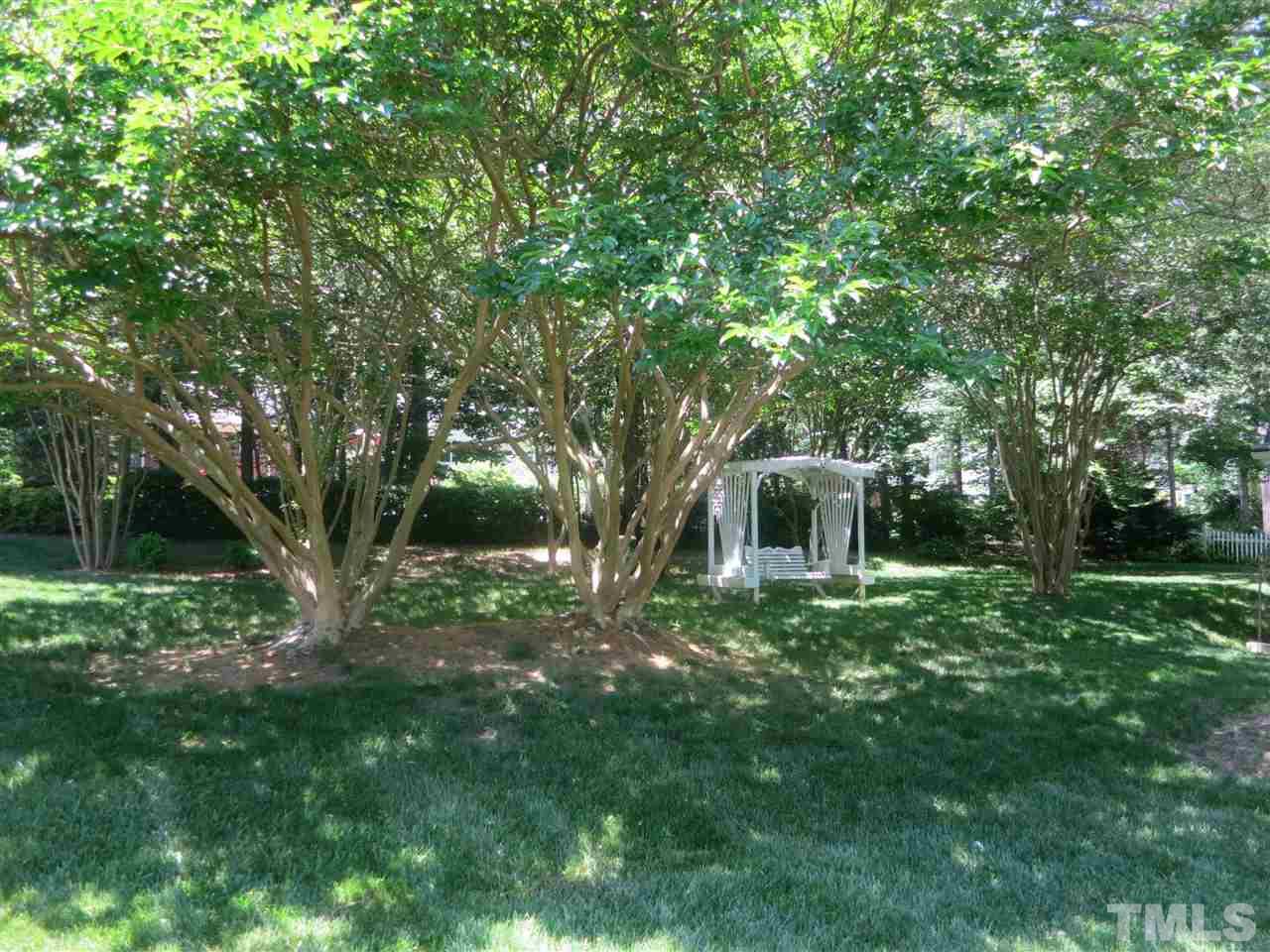 6701 Valley Drive Raleigh, NC 27612 - Photo 4 of 4 a view of a backyard with large trees