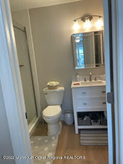 216 Eisenhower Avenue Seaside Heights, NJ 08751 - Photo 13 of 43 a bathroom with a sink toilet and mirror