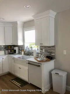 a kitchen with a sink and cabinets