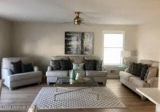 a living room with furniture and a rug