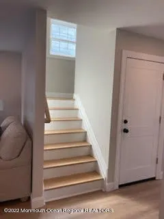 a bedroom with a bed and glass window