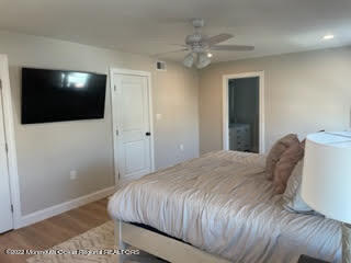 216 Eisenhower Avenue Seaside Heights, NJ 08751 - Photo 28 of 43 a bedroom with a large bed and a flat tv screen